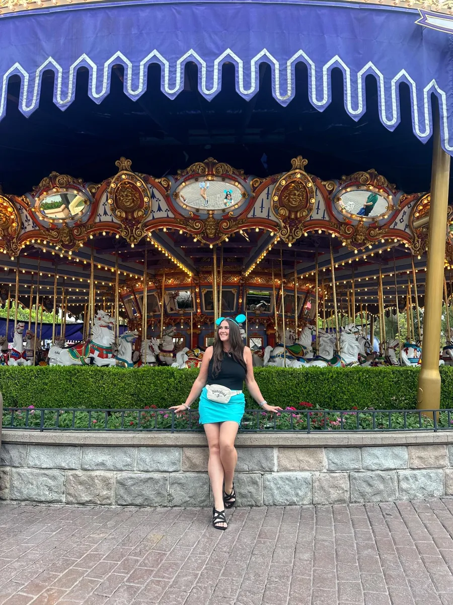 Your advisor in front of Prince Charming Regal Carrousel at Magic Kingdom
